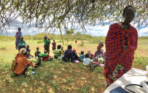 Gathering of community women at outreach clinic