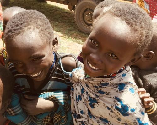 Two smiling faces at an outreach clinic